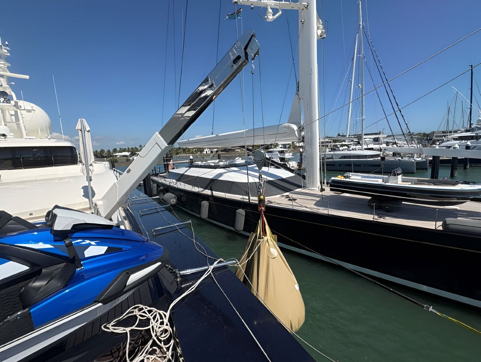 A water bag hanging from a yacht's davit during a rescue boat load test