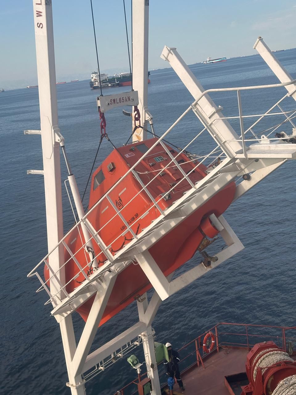 Maritime service provider carrying out lifeboat maintenance